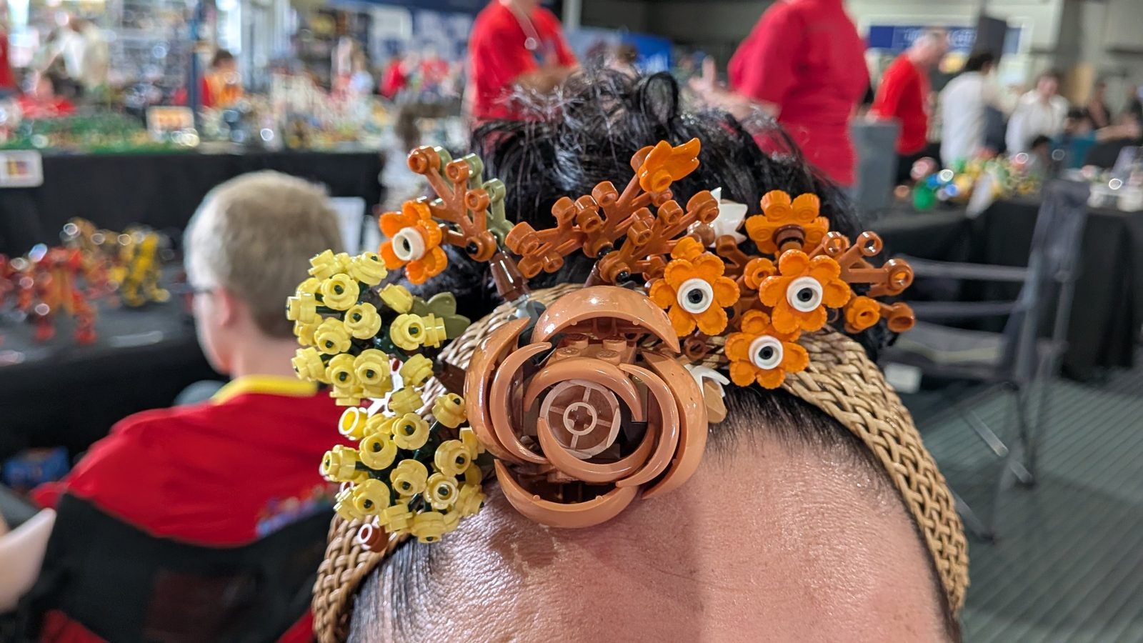 A headband decorated with LEGO flowers