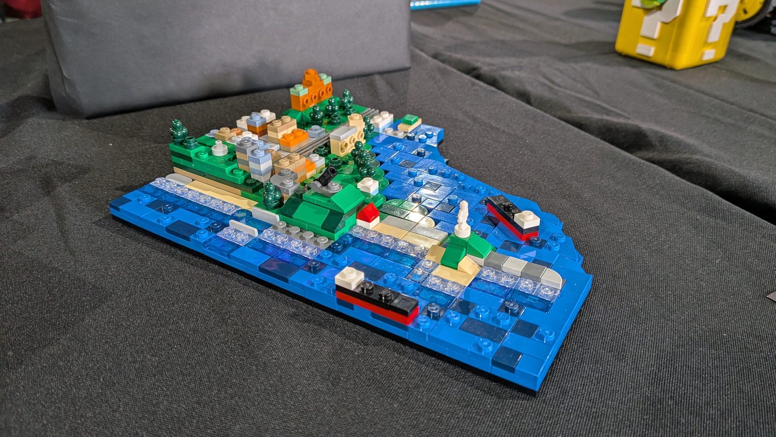 A small microscale coastal harbour scene with ships